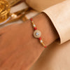 Designer American Diamond Rakhi with Pearl & Crystal Beads
